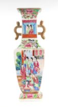 A late 19th century Chinese Canton Export famille rose two-handled vase decorated with figures and