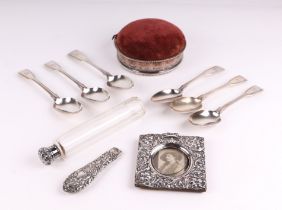 A set of six Victorian silver fiddle pattern dessert spoons, crested, London 1860, 309g, a silver