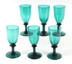 A set of six Victorian Bristol green drinking glasses, 14cms high (6). Condition Report One base has