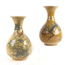 A Lladro baluster form vase decorated in the Japanese taste depicting a dragon on an olive ground,