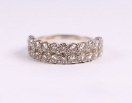 An 18ct white gold diamond ring set with twenty two diamonds in two rows, approx UK size 'Q', 4.4g.
