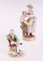 A Meissen figural group depicting a young lady with a lamb, 18cms high; together with a Meissen