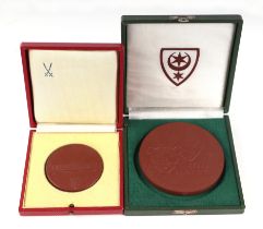 A terracotta medallion commemorating 75 years of Halle Zoo (1901-1976), cased; and another