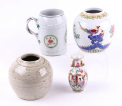 An 18th century Chinese porcelain tankard (a/f), 13cms high; together with a miniature Chinese