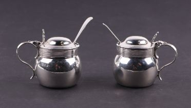 A pair of silver mustard pots with associated spoons and blue glass liners, London 1924, weighable