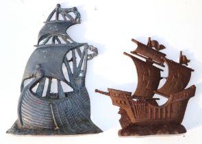 Two cast iron door stops in the form of galleons, 40cm and 30cm high (2)