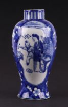 A Chinese blue & white baluster vase decorated with figures within panels, on a cracked ice prunus