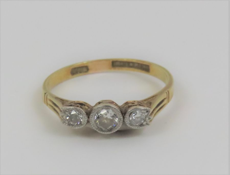 An early 20th century three stone diamond ring, th