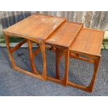 A nest of three mid century tables