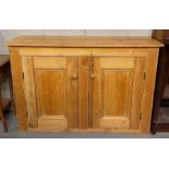 A Victorian two pine door cupboard, with two adjustable