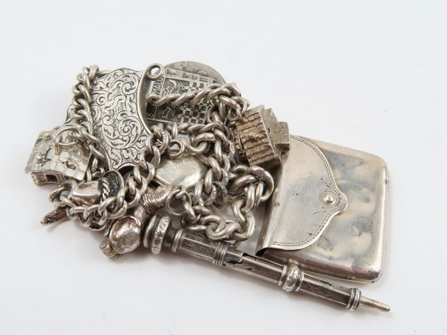 A silver curb link bracelet, with various charms a - Image 10 of 10