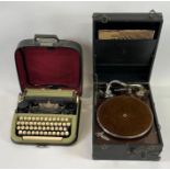 A vintage typewriter, along with a vintage record