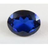 A loose synthetic sapphire, 2.83ct; a collection o