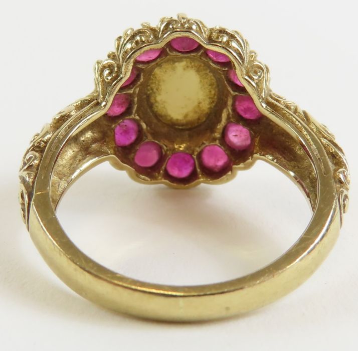 A 9ct gold opal and ruby cluster ring, the oval op - Image 5 of 9