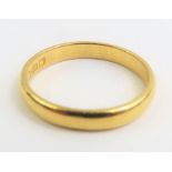 A 22ct gold wedding band, 3.6mm wide, finger size V, 5.7g gross