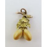 A Victorian deer's teeth set pendant with oak leaf