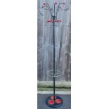 A vintage/mid century coat stand, with red drip pa
