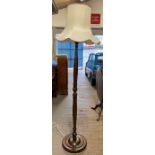 A mid century mahogany standard lamp, carved