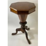 A Victorian mahogany sewing table, standing on tri