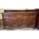 An 18th century oak sideboard, with moulded drawer