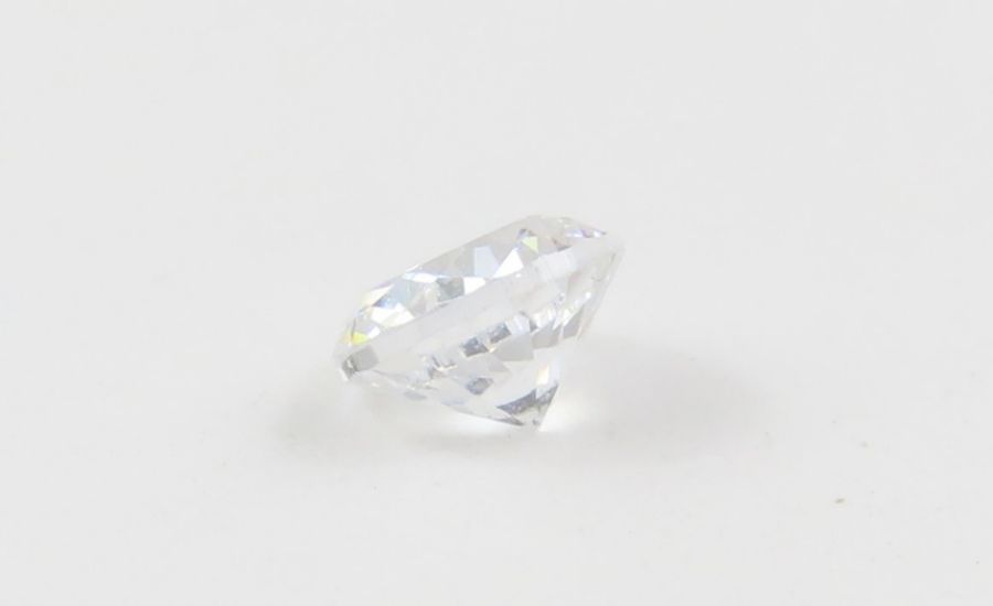 A loose round brilliant cut diamond, 0.10ct, toget