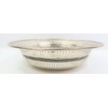 A bowl with linear pierced sides and reeded rim, t