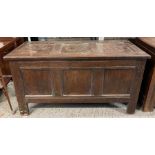 A 18th century oak coffer, of panelled form, 69cm