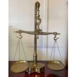 A 20th century brass set of hanging scales and wei