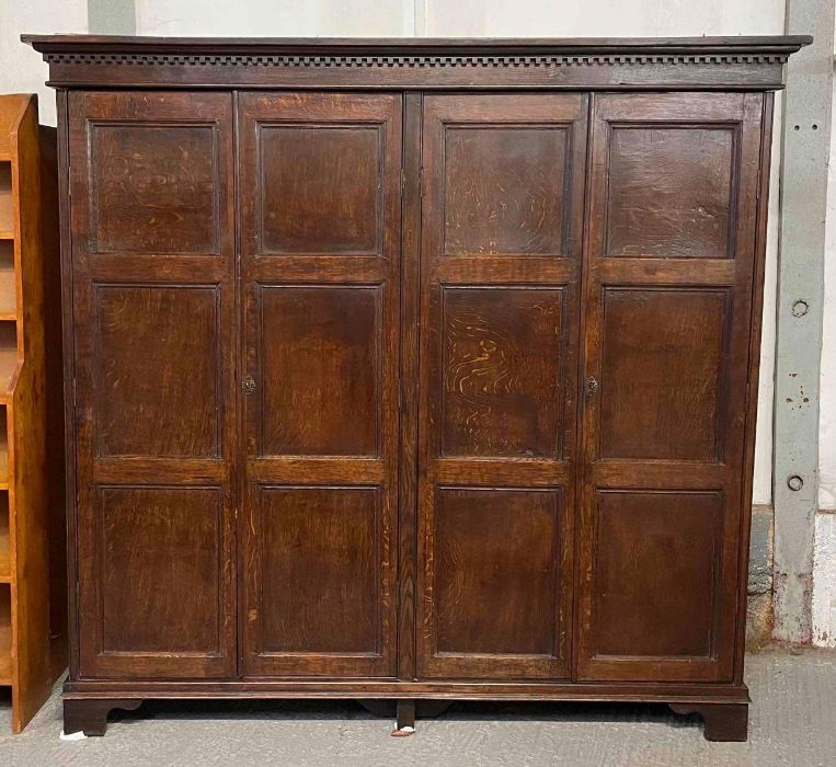 A 19th century oak four door wardrobe, of panelled