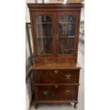 A Victorian and later two section bookcase, with a