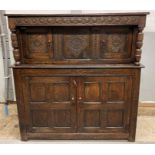 A 19th century oak court cupboard, with carved doo