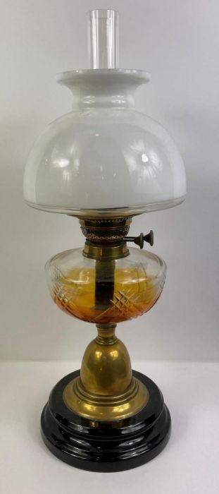 A 20th century oil lamp, with white glass reservoir