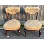 A pair of Edwardian nursing chairs, each with maho