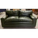 A vintage Heals green leather "Palermo" two seater