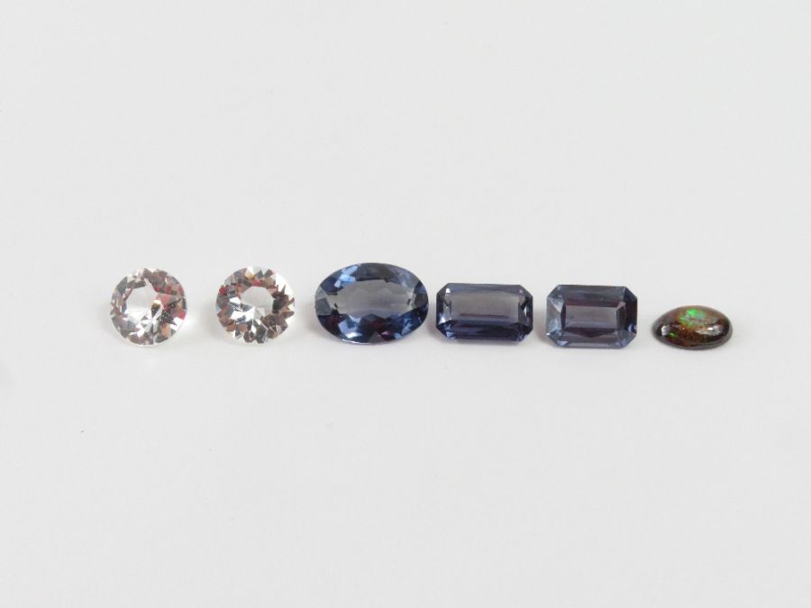 A quantity of loose gemstones - a pair of syntheti