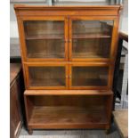 A 20th century mahogany bookcase, the glazed top s