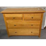 A modern oak chest of two short and two