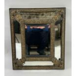 A Victorian bevelled wall mirror, with embossed