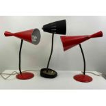 A pair of red mid century lamps, along with one ot