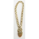 A 9ct gold fancy link bracelet with heart padlock,