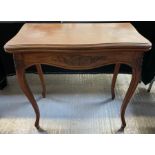 A 20th century foldover shaped card table, standin