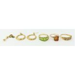 A 9ct gold peridot five stone dress ring, a 9ct go