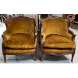 A pair of carved French style open armchairs, upho