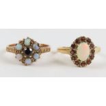 A 9ct gold opal and garnet cluster ring, finger si