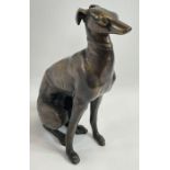 A modern brass model of a seated greyhound dog, 52