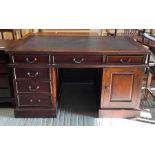 A 20th century mahogany twin pedestal desk, with a