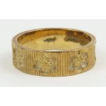 A 9ct gold wedding band, decorated with flowers, f