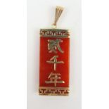 A rectangular orange hardstone pendant, with Chine