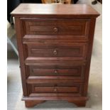 A 20th century oak chest of drawers, set with four