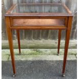 An Edwardian standing glass display cabinet, on ca